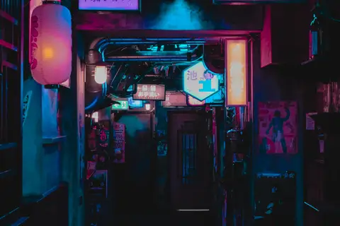 A lantern-lit alleyway glowing after dark