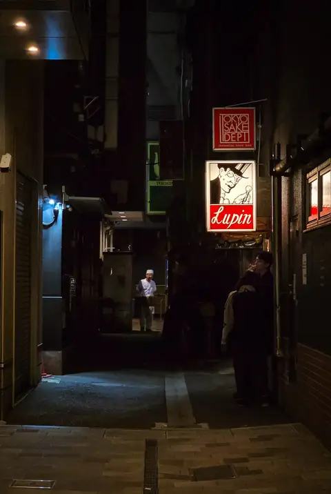 A moody, neon-lit alley at night